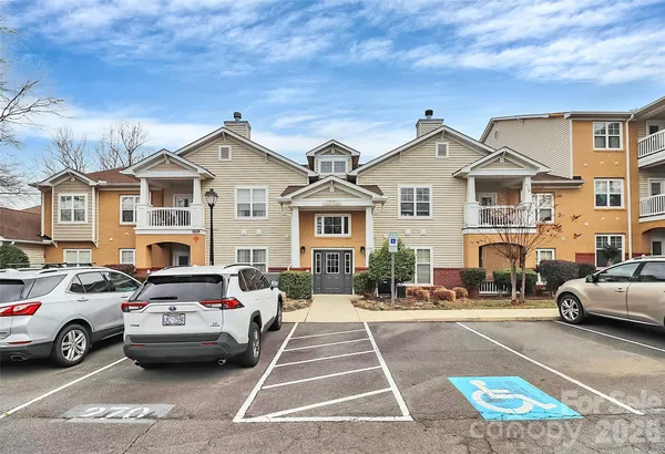 a view of a car parked in front of a house