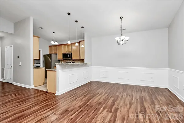 a view of a kitchen with microwave and cabinets