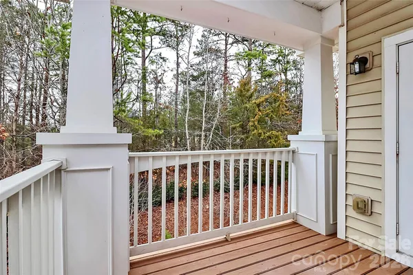 a view of a balcony with wooden floor