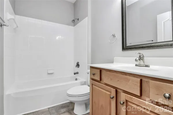 a bathroom with a sink a toilet and a bathtub