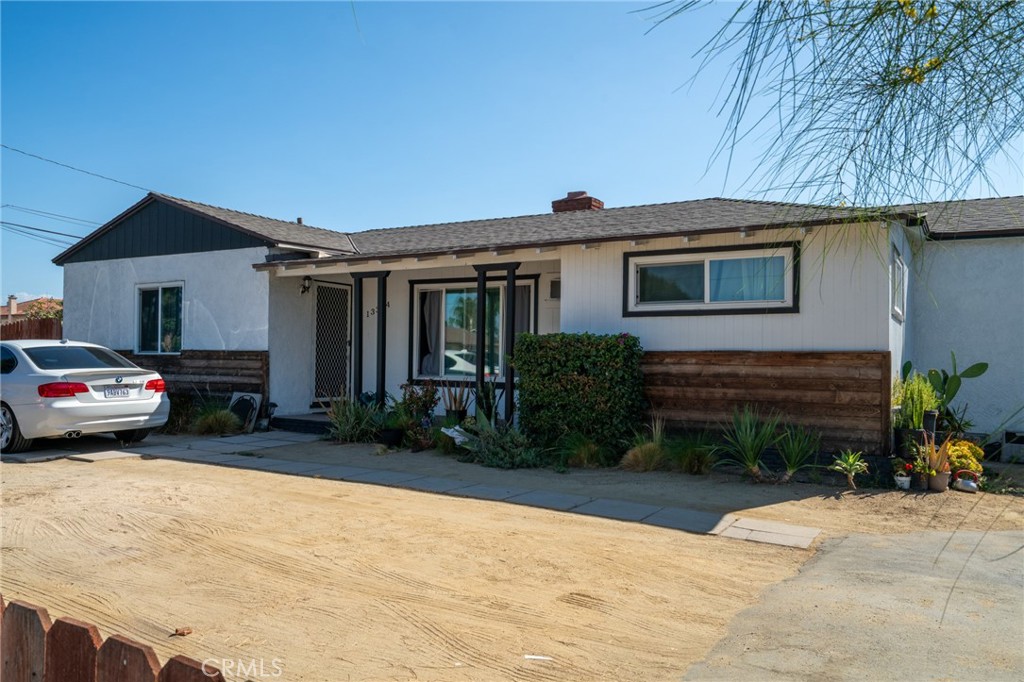 13392 Magnolia Street Garden Grove, CA 92844 - Photo 2 of 15 a view of house and yard with car parked