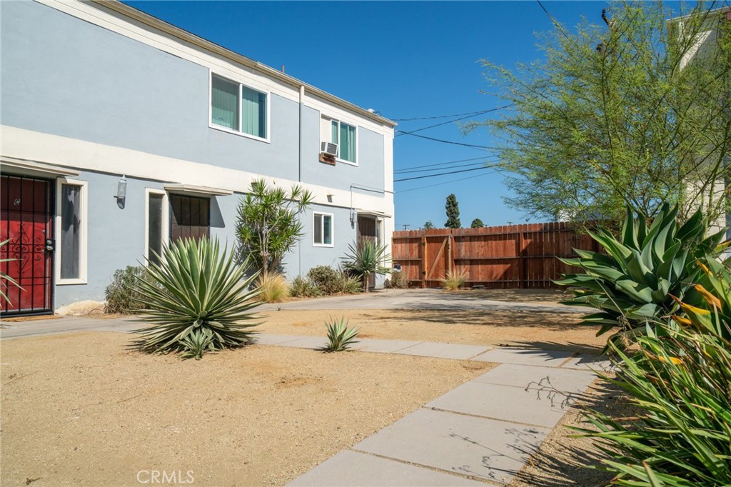 13392 Magnolia Street Garden Grove, CA 92844 - Photo 4 of 15 a view of a house with a yard