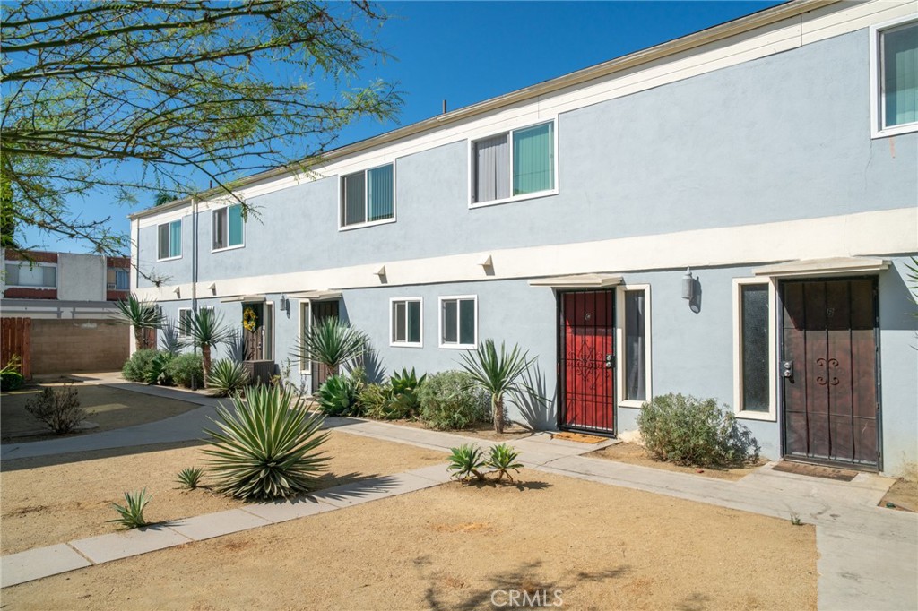 13392 Magnolia Street Garden Grove, CA 92844 - Photo 7 of 15 a front view of a house with a yard