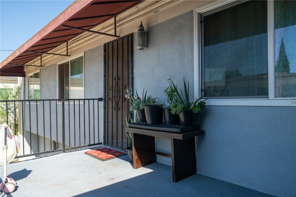 13392 Magnolia Street Garden Grove, CA 92844 - Photo 10 of 15 a vase of flowers sitting on a table in front of a house