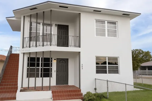 a front view of a house with a large window