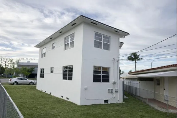 a view of house with yard