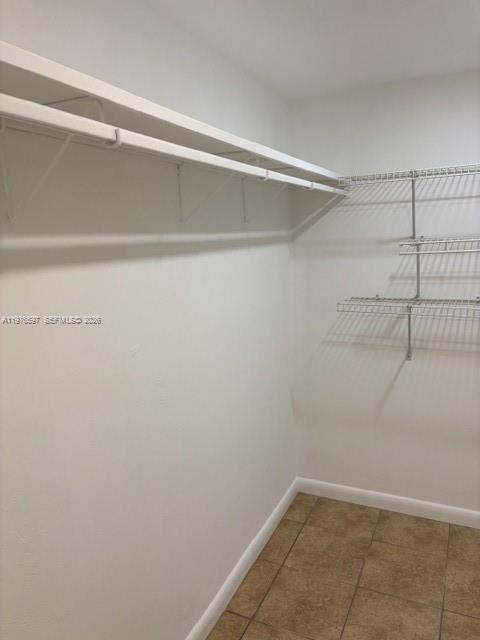 9493 Southwest 76th Street, Unit L4 Miami, FL 33173 - Photo 23 of 33 a view of a room with racks on the wall