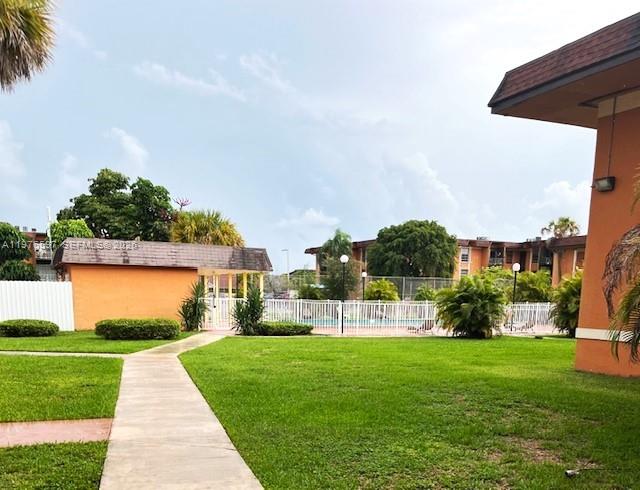 9493 Southwest 76th Street, Unit L4 Miami, FL 33173 - Photo 26 of 33 a view of building with garden