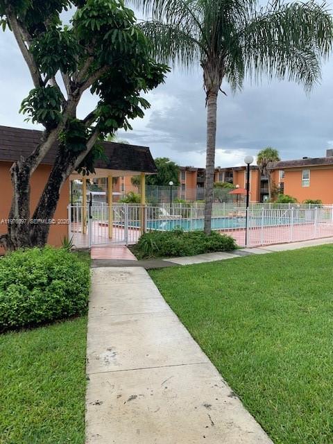 9493 Southwest 76th Street, Unit L4 Miami, FL 33173 - Photo 27 of 33 a view of a park with palm trees