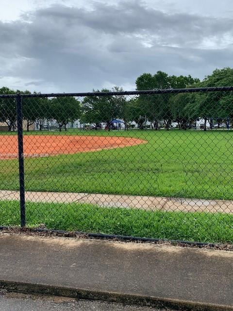 9493 Southwest 76th Street, Unit L4 Miami, FL 33173 - Photo 32 of 33 a view of a garden