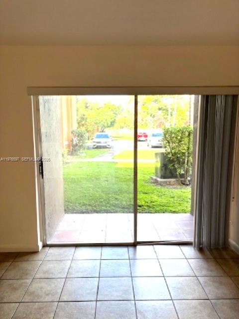9493 Southwest 76th Street, Unit L4 Miami, FL 33173 - Photo 10 of 33 a view of an empty room and window