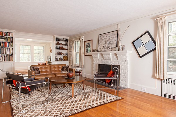 18 Fredana Road Newton, MA 02468 - Photo 2 of 7 a living room with furniture a rug and a bookshelf