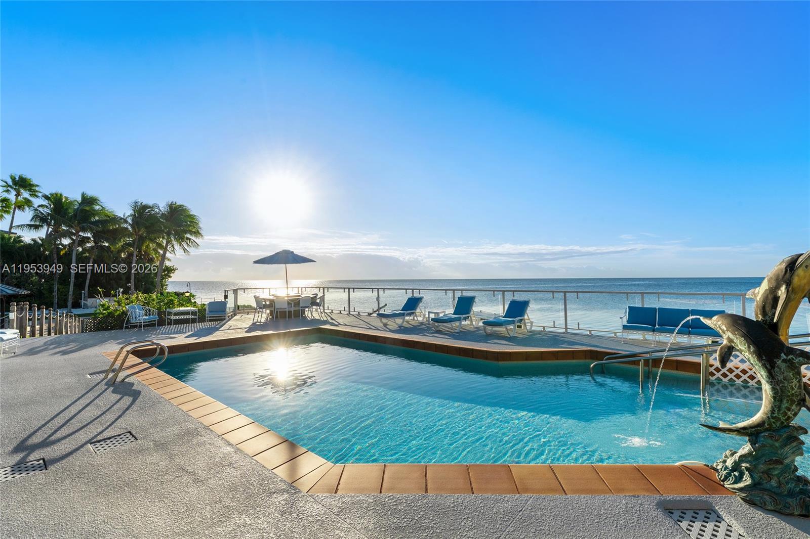 720 Lugo Avenue Coral Gables, FL 33156 - Photo 11 of 71 a view of a swimming pool with outdoor seating