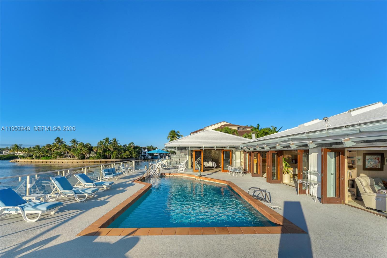 720 Lugo Avenue Coral Gables, FL 33156 - Photo 14 of 71 a view of a house with pool and chairs