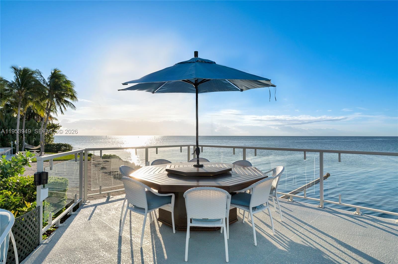 720 Lugo Avenue Coral Gables, FL 33156 - Photo 17 of 71 a table and chairs in the terrace