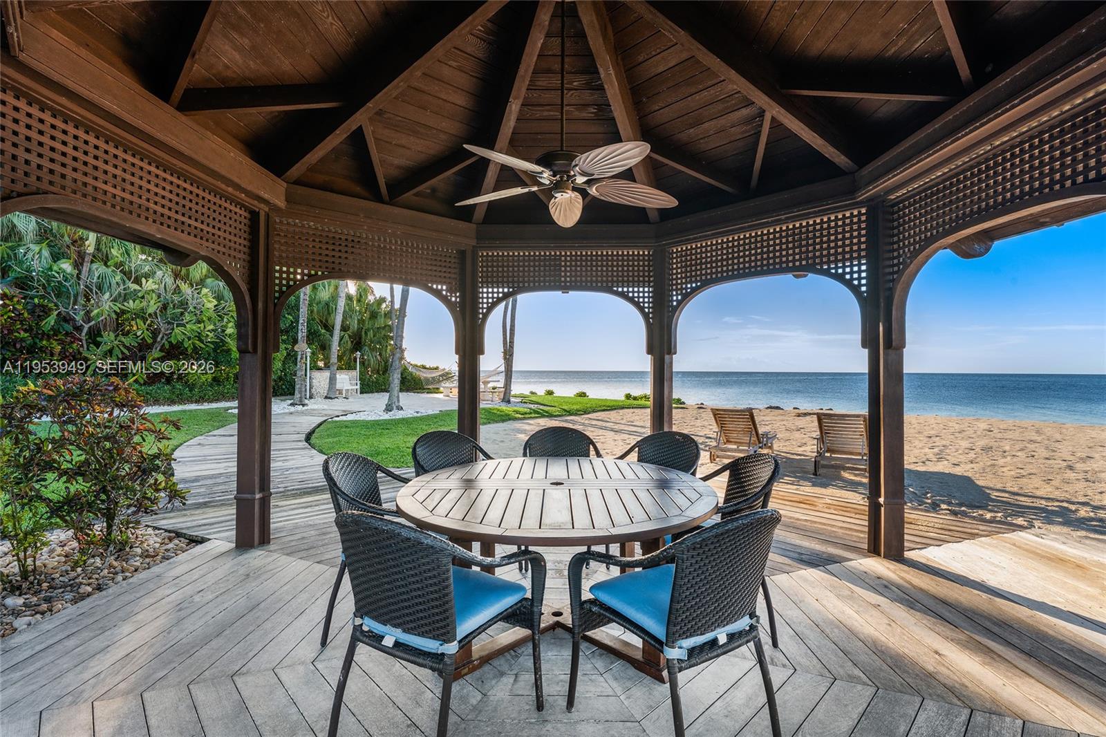 720 Lugo Avenue Coral Gables, FL 33156 - Photo 25 of 71 a view of a patio with a table chairs and a table