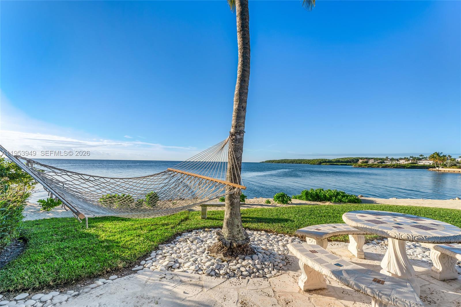 720 Lugo Avenue Coral Gables, FL 33156 - Photo 29 of 71 a view of a patio with a table and chairs