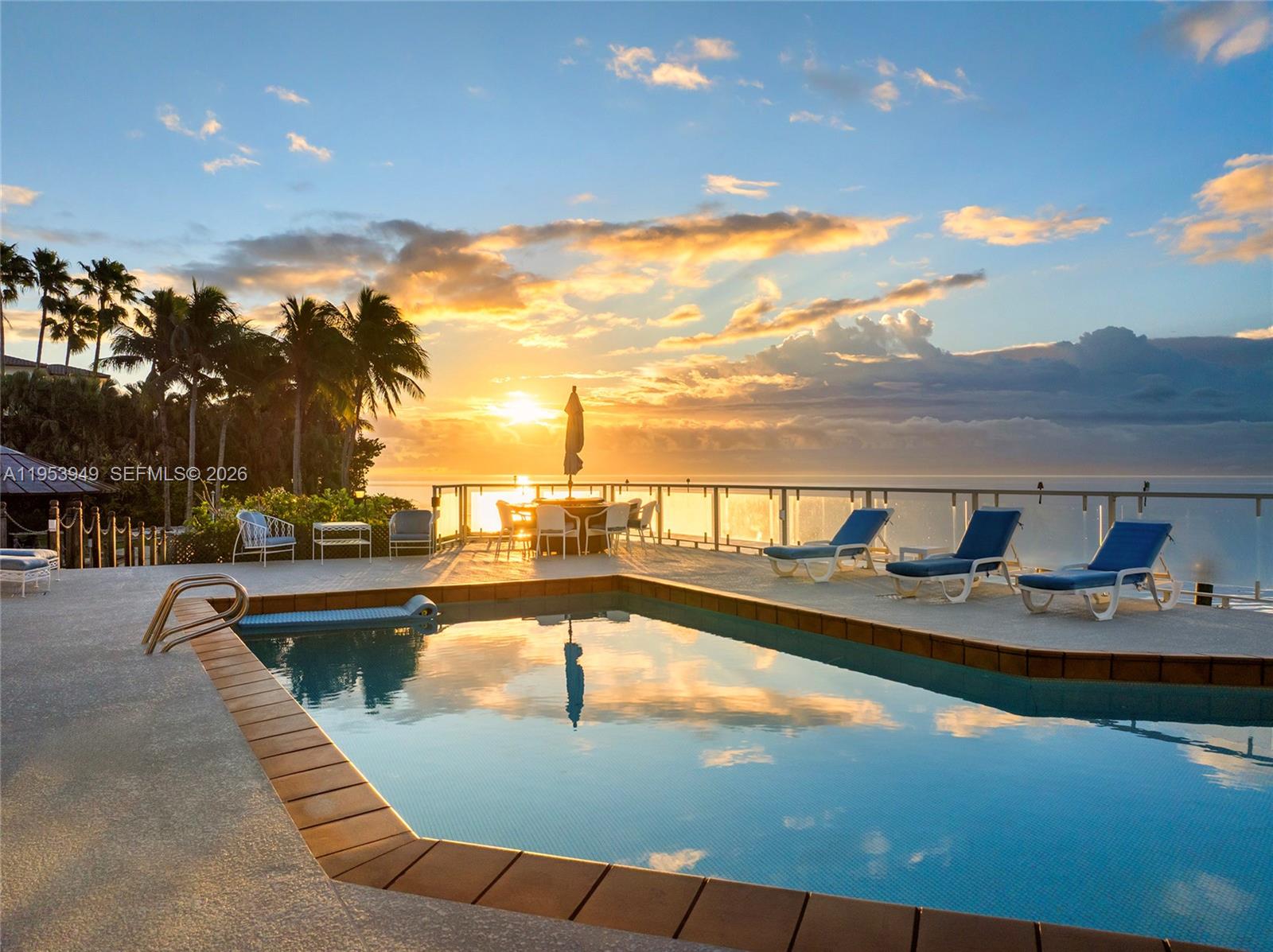 720 Lugo Avenue Coral Gables, FL 33156 - Photo 3 of 71 a view of a swimming pool with lounge chairs