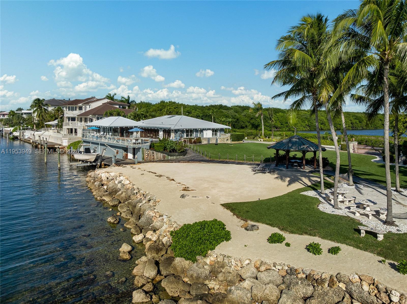 720 Lugo Avenue Coral Gables, FL 33156 - Photo 31 of 71 a view of swimming pool with outdoor seating and plants