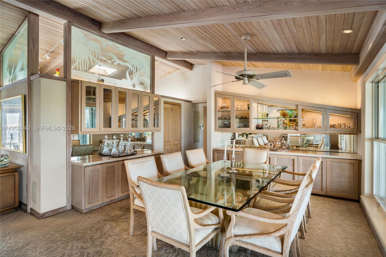 720 Lugo Avenue Coral Gables, FL 33156 - Photo 38 of 71 a dining room with stainless steel appliances kitchen island granite countertop furniture and a fireplace