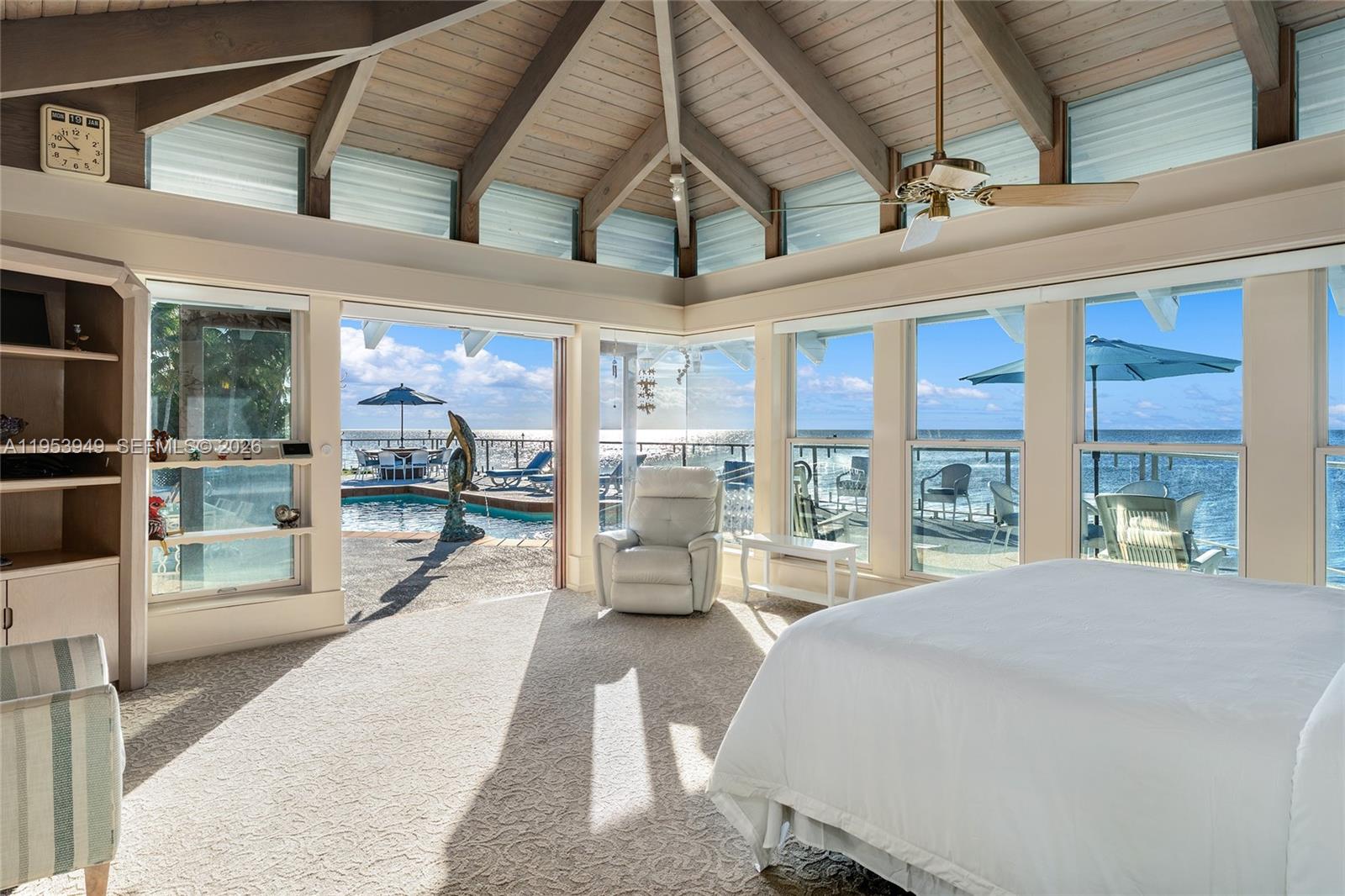 720 Lugo Avenue Coral Gables, FL 33156 - Photo 50 of 71 a spacious bedroom with a large bed and a large window