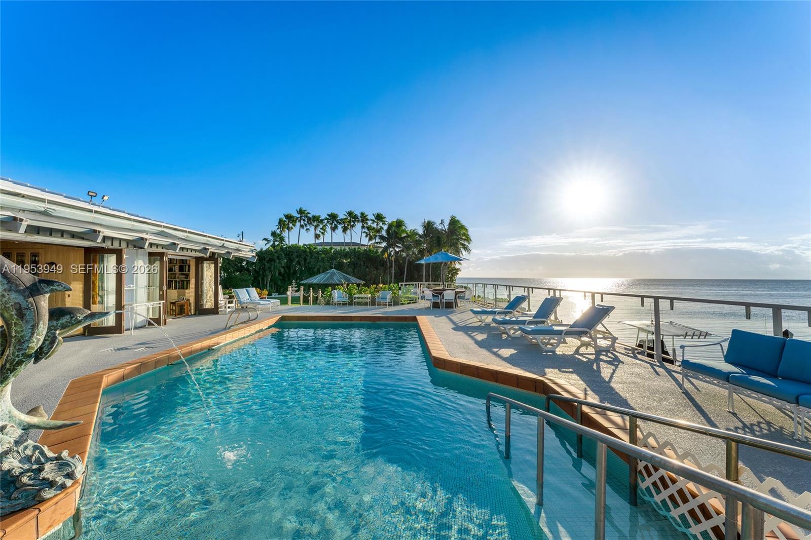 720 Lugo Avenue Coral Gables, FL 33156 - Photo 5 of 71 a view of a house with swimming pool and sitting area