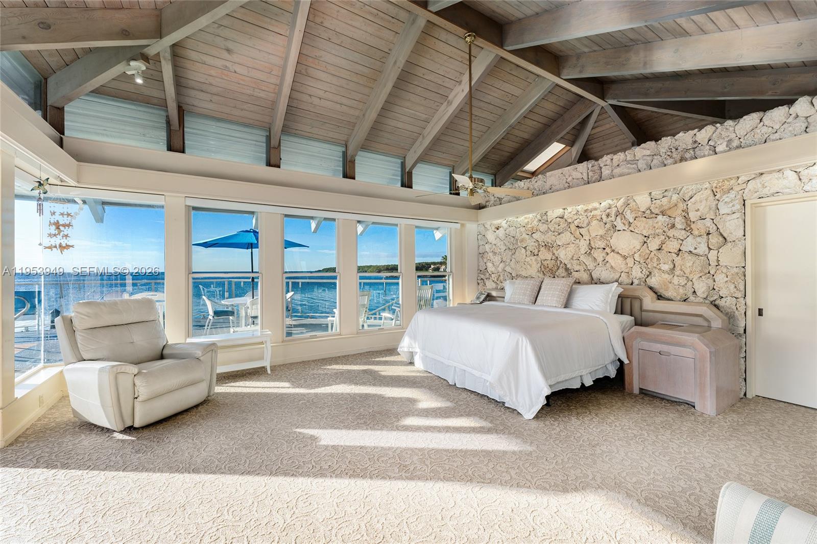 720 Lugo Avenue Coral Gables, FL 33156 - Photo 51 of 71 a spacious bedroom with a bed and a large window