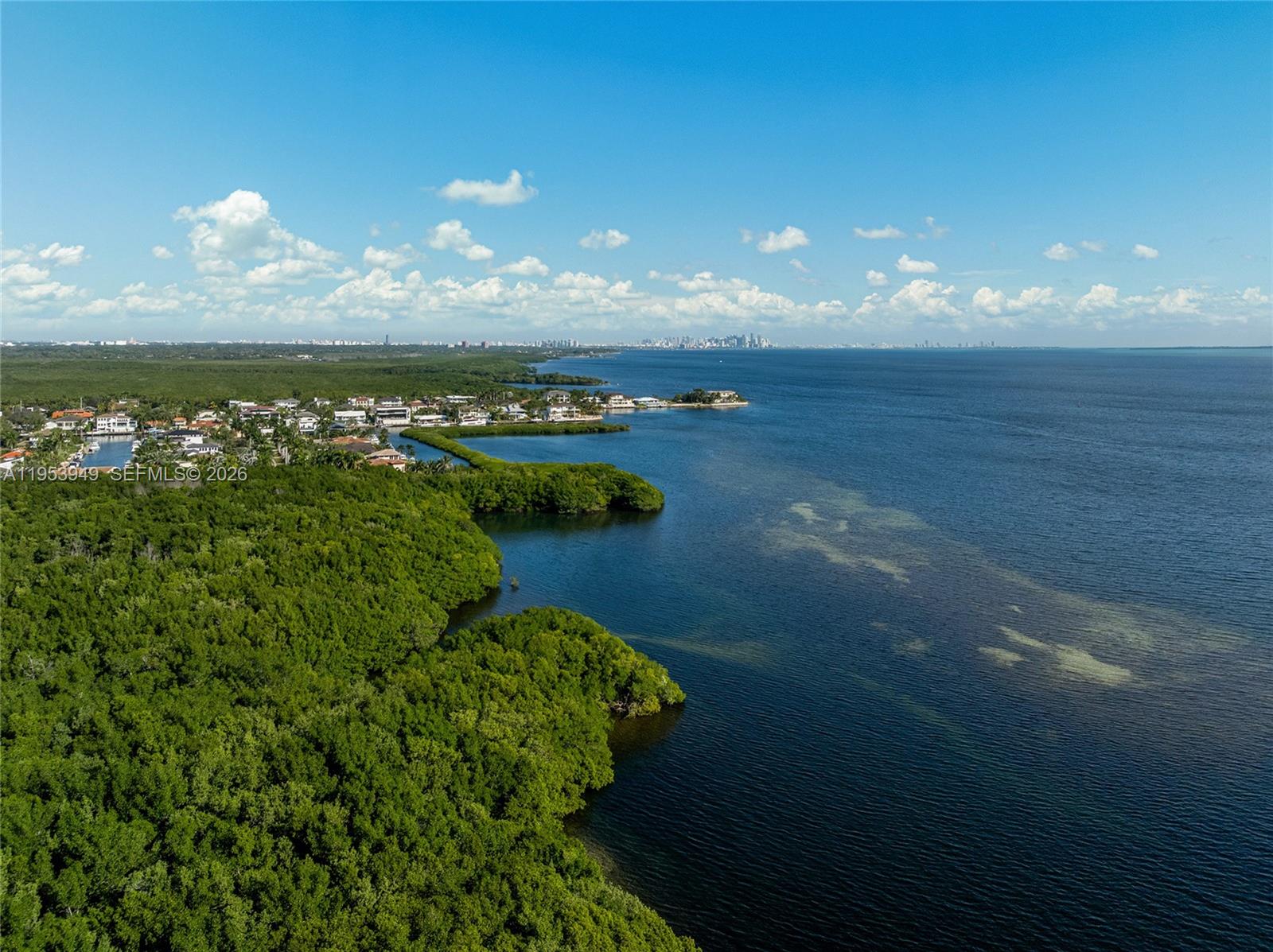 720 Lugo Avenue Coral Gables, FL 33156 - Photo 68 of 71 a view of a lake in a sunset