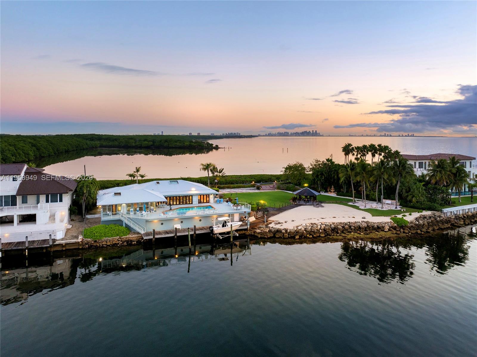720 Lugo Avenue Coral Gables, FL 33156 - Photo 69 of 71 a terrace with outdoor seating and city view