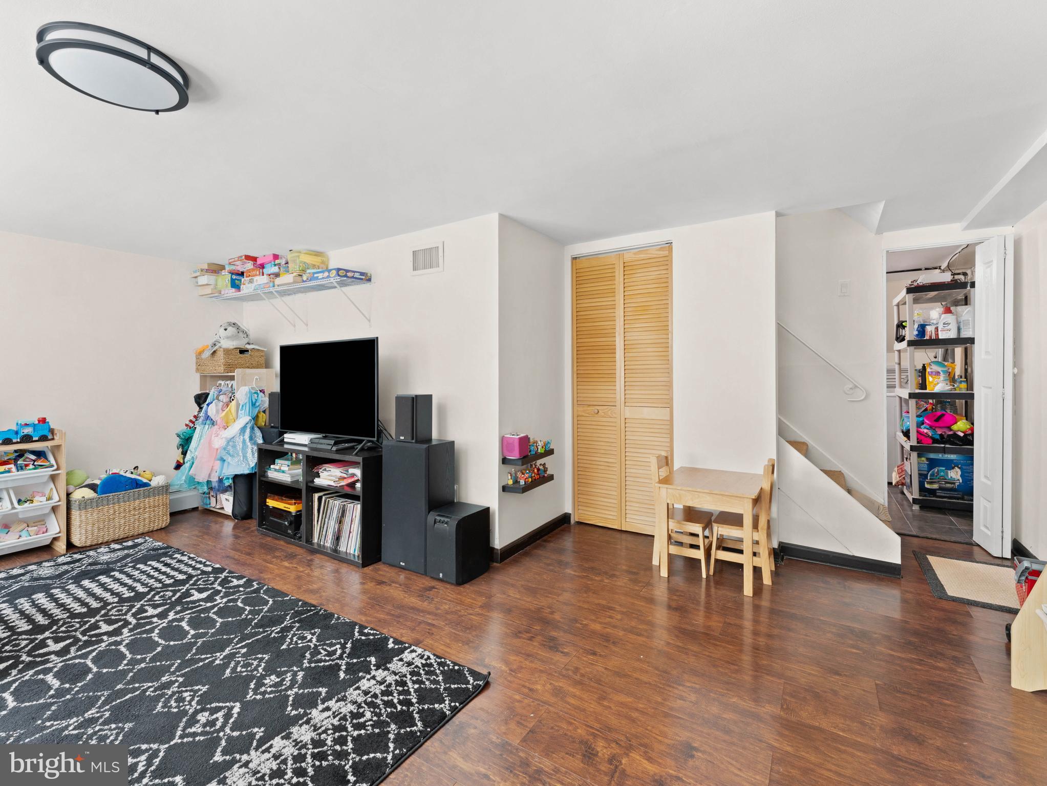 10839 Rayland Road Philadelphia, PA 19154 - Photo 24 of 30 a living room with furniture and a flat screen tv with wooden floor