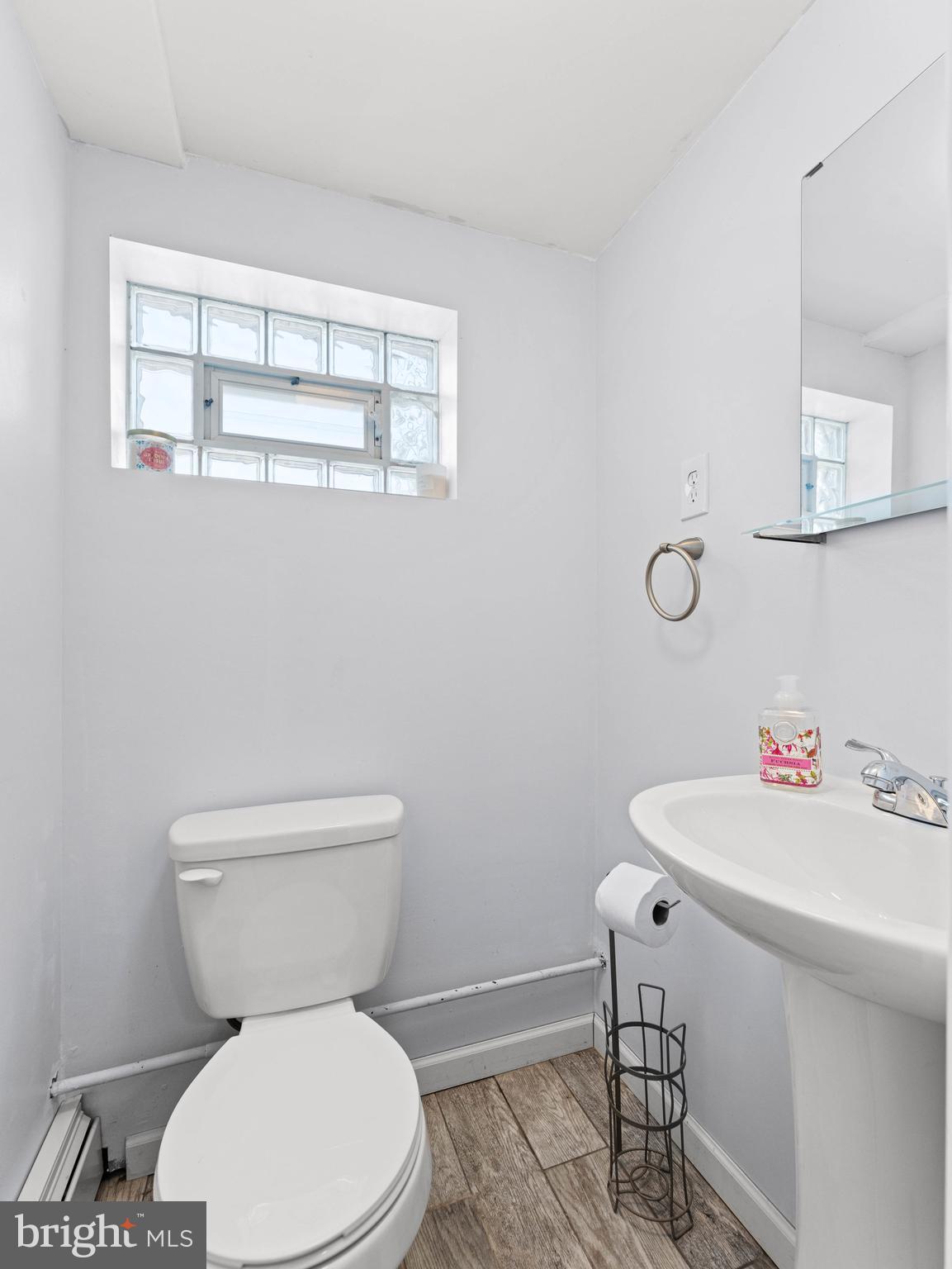10839 Rayland Road Philadelphia, PA 19154 - Photo 25 of 30 a white toilet sitting next to a bathroom sink