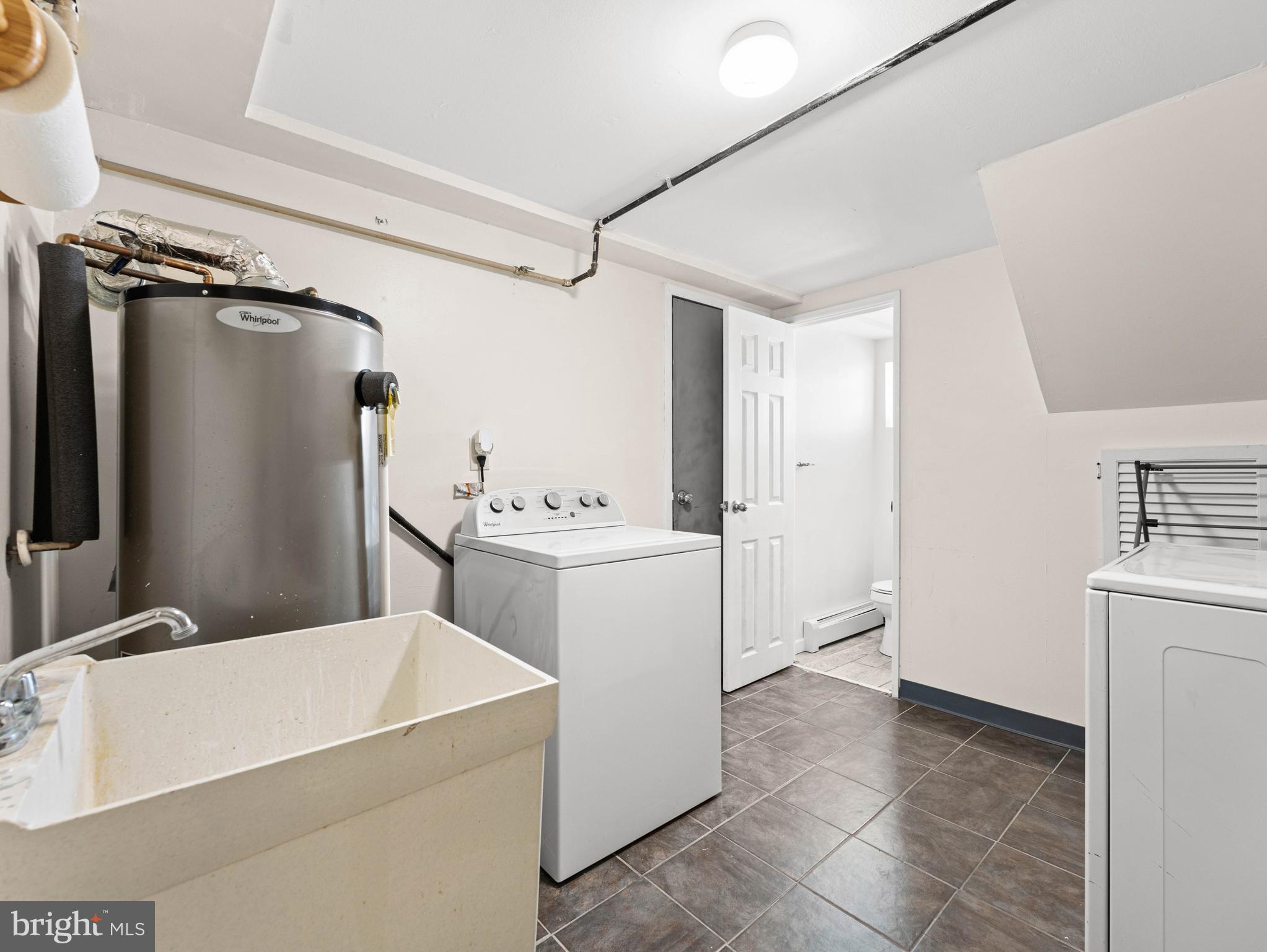 10839 Rayland Road Philadelphia, PA 19154 - Photo 26 of 30 a utility room with cabinets washer and dryer