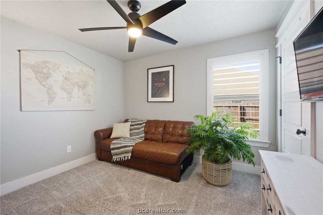 244 Brazos Bend Snook, TX 77879 - Photo 25 of 33 a living room with furniture potted plant and a window