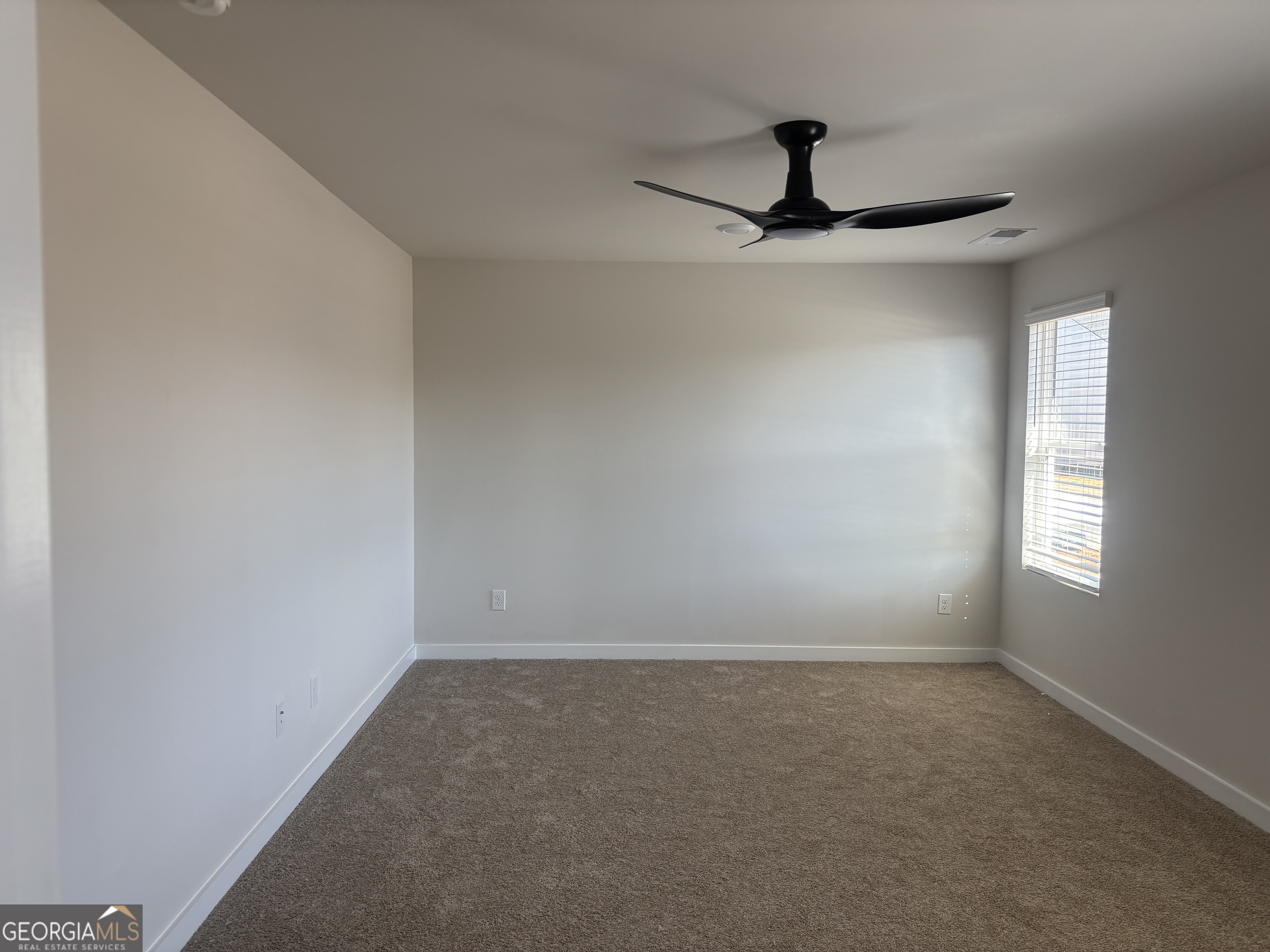 5367 Tolar Road South Fulton, GA 30213 - Photo 16 of 29 an empty room with a window and a ceiling fan