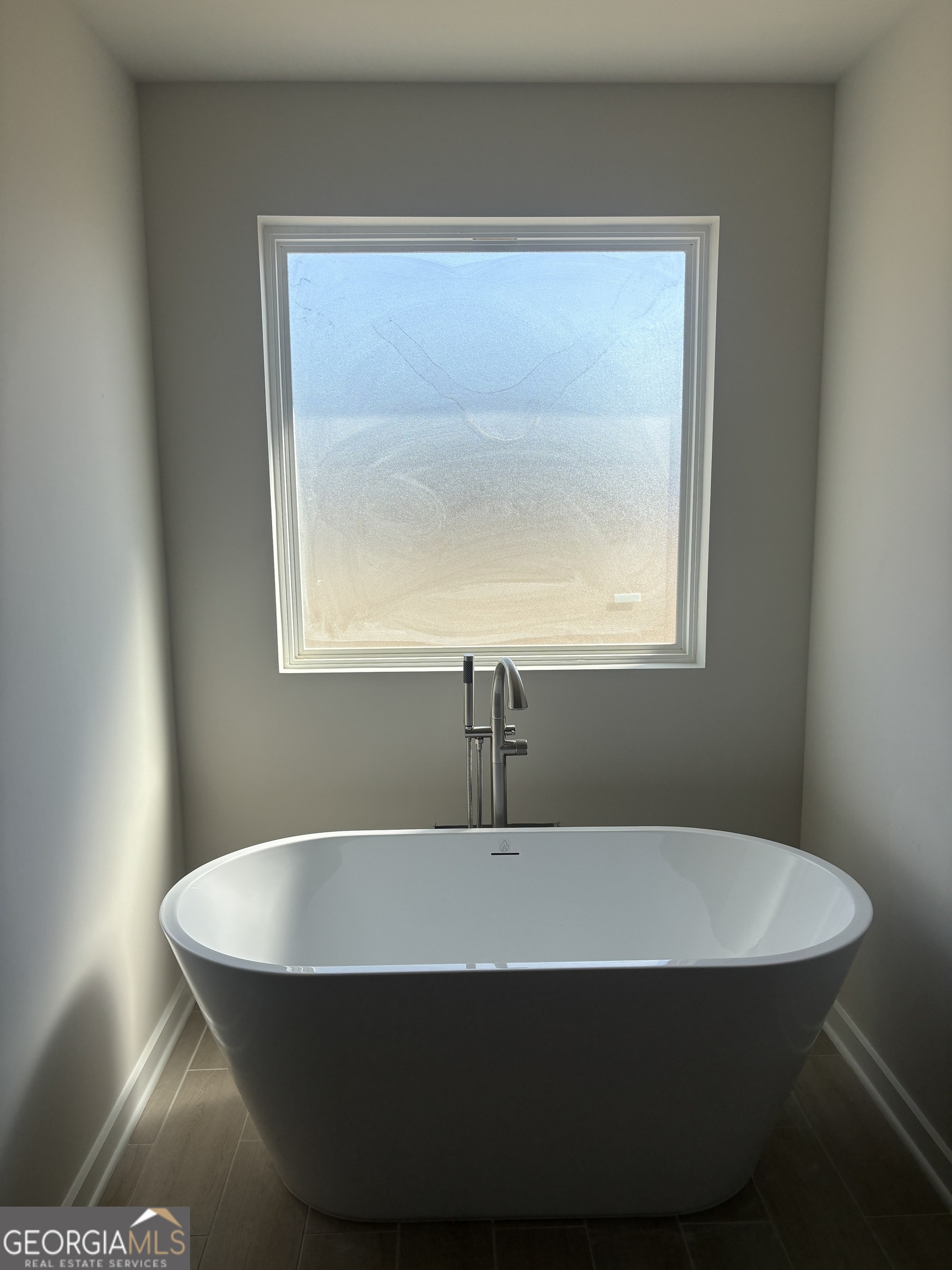 5367 Tolar Road South Fulton, GA 30213 - Photo 19 of 29 a white bath tub sitting in a bathroom