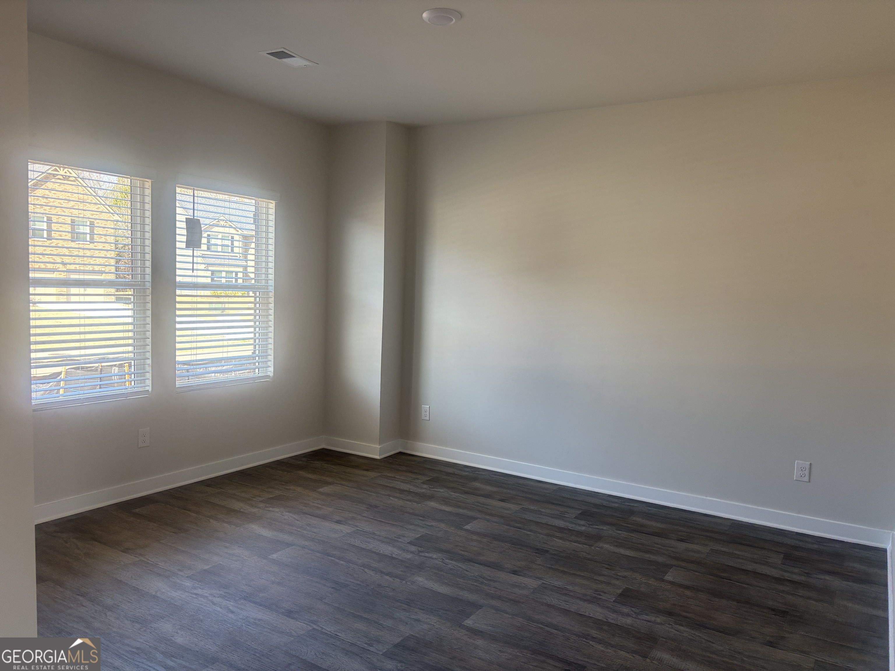 5367 Tolar Road South Fulton, GA 30213 - Photo 20 of 29 a view of an empty room with wooden floor and a window
