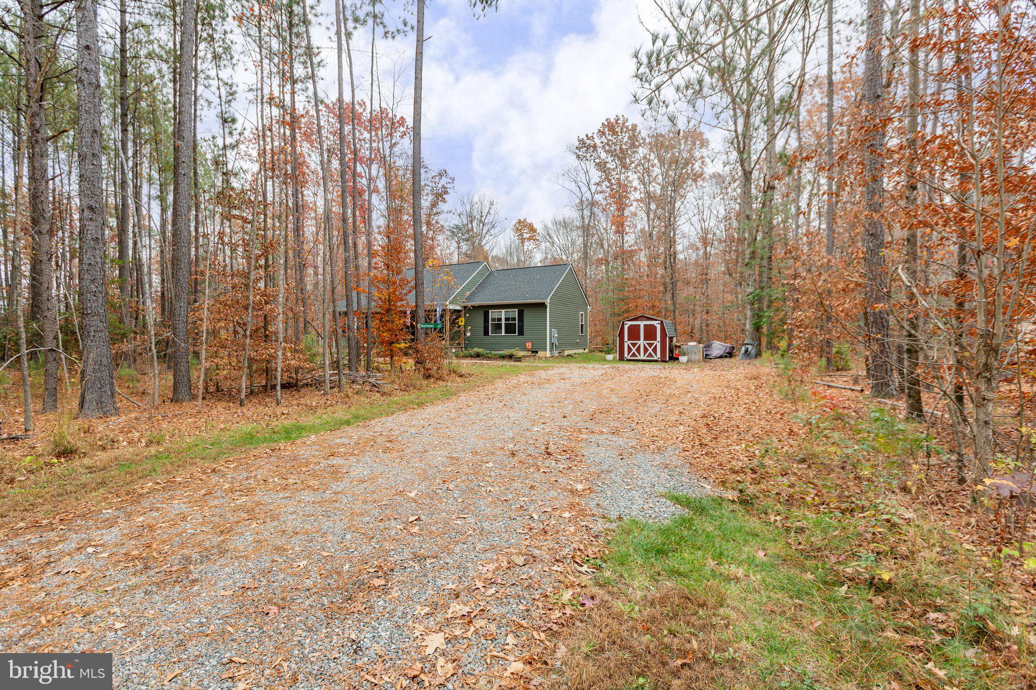 356 Greenes Corner Road Bumpass, VA 23024 - Photo 4 of 41 Long, gravel driveway