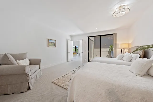 a bathroom with a toilet sink a shower and a mirror