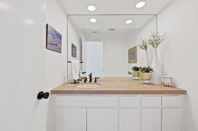 a spacious bedroom with a large bed and a large window