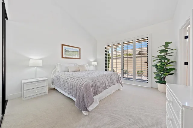 a bathroom with a double vanity sink mirror and shower
