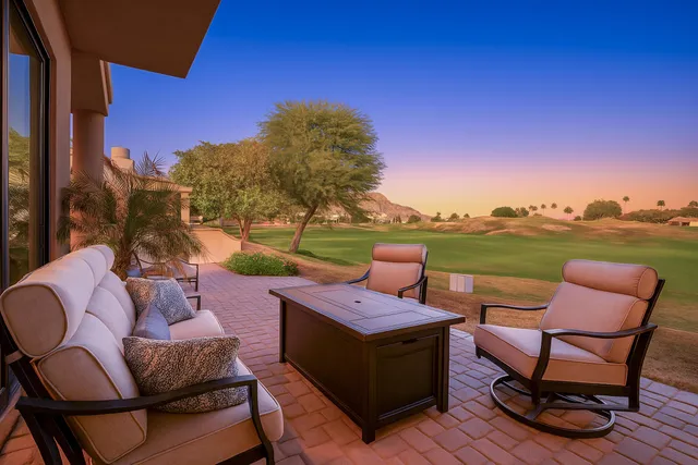 a view of a chairs and table in the terrace