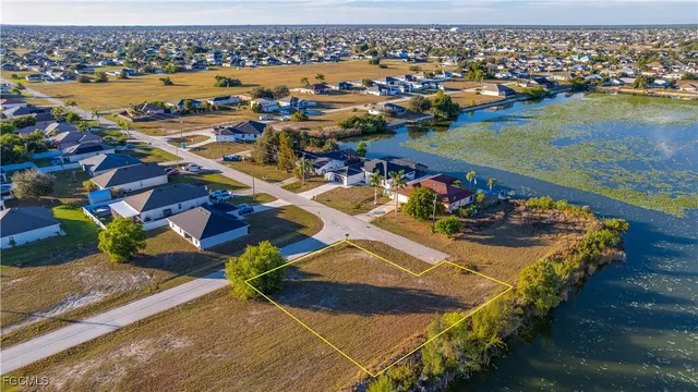 an aerial view of a house with a ocean view