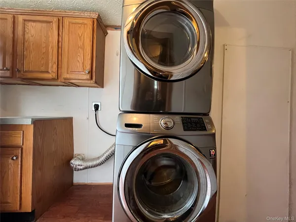a close view of a utility room with dryer and washer