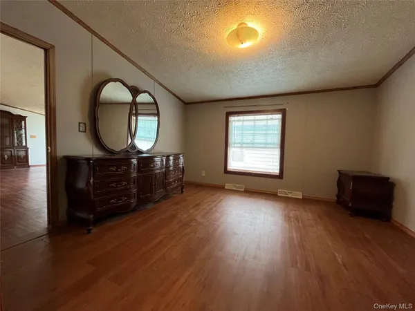an empty room with windows mirror and windows