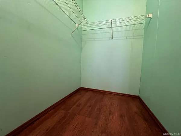 a view of a small space with racks on the wall