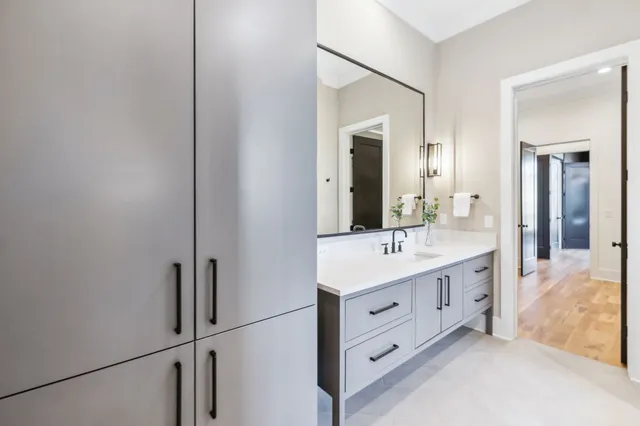 a bathroom with a sink and a mirror