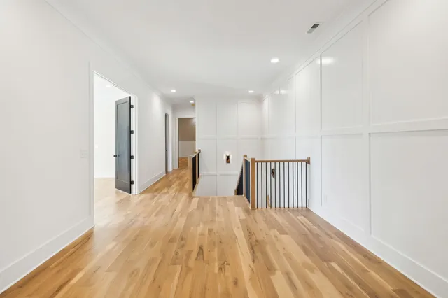 an aerial view of residential house with outdoor space and trees all around