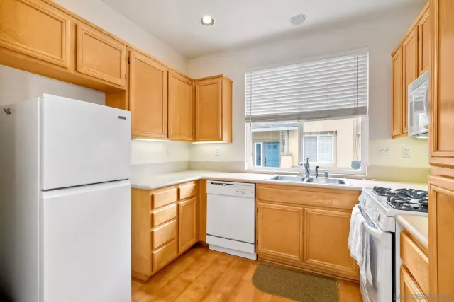 a kitchen with a stove microwave and refrigerator