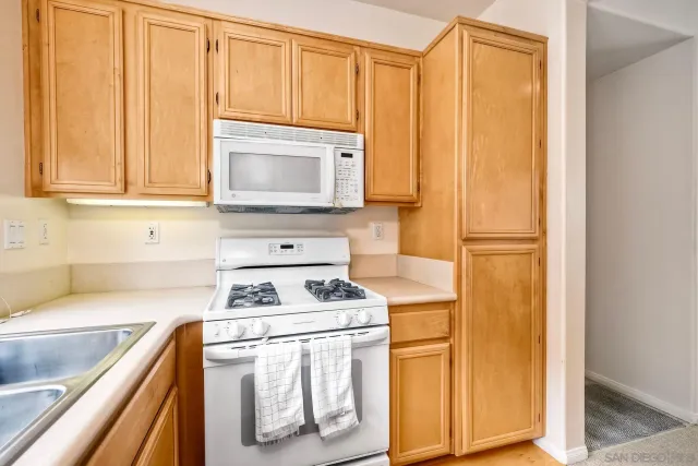 a white refrigerator freezer sitting next to a window