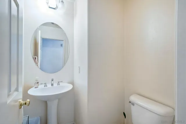 a bedroom with a bed and chair